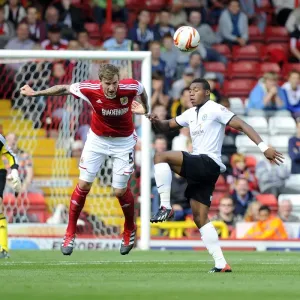 Intense Aerial Battle: Flint vs Assombalonga - Football Rivalry in the Sky