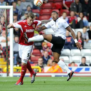 Intense Aerial Battle: Flint vs Assombalonga - Football Rivalry in the Sky (Bristol City vs Peterborough)