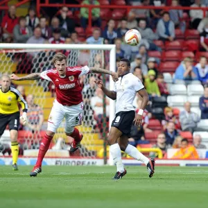 Intense Aerial Battle: Flint vs Assombalonga - Football Rivalry in the Sky (Bristol City vs Peterborough)