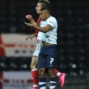Intense Aerial Clash: Joe Bryan vs Chris Humphrey at Deepdale Stadium Intense Aerial Clash: Joe Bryan vs Chris Humphrey at Deepdale Stadium