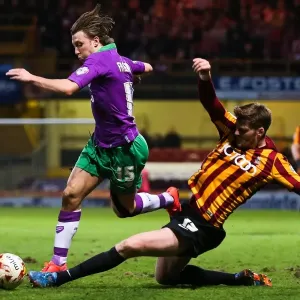 Intense Battle: Ben Williams Tackles Luke Freeman in Bradford City vs. Bristol City Football Match