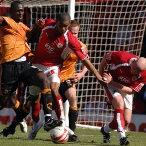 Intense Battle for Possession: Marvin Elliott vs. Wolverhampton Wanderers