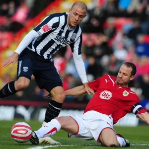 Intense Football Championship Clash: Louis Carey Tackles Roman Bednal - Bristol City vs. West Bromwich Albion, 2010