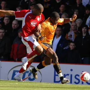 Intense Football Rivalry: Marvin Elliott vs. Wolverhampton Wanderers - Battle for Possession