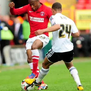 Intense Moment: Bobby Reid vs. Callum Harriott - A Hard-Fought Tackle in the Npower Championship Clash Between Charlton Athletic and Bristol City Intense Moment: Bobby Reid vs. Callum Harriott - A Hard-Fought Tackle in the Npower Championship Clash Between Charlton Athletic and Bristol City