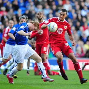 Intense Rivalry: Burke vs. Caulker in the Npower Championship Clash at Cardiff City Stadium (October 16, 2010)