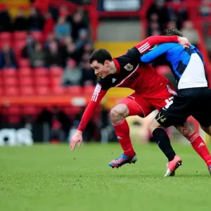 Intense Rivalry: Cunningham vs. O'Brien's Battle for Ball Possession, Bristol City vs. Barnsley