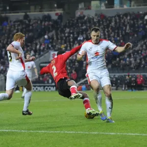Print of a football challenge between MK Dons and Bristol City Print of a football challenge between MK Dons and Bristol City
