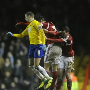 Intense Rivalry: Marlon Pack and Carl Baker Battle for Header in Bristol City vs Coventry City Football Match, 2014