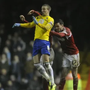 Intense Rivalry: Marlon Pack, Greg Cunningham, and Carl Baker Battle for Header in Bristol City vs Coventry City Football Match, 2014