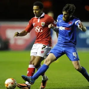 Intense Rivalry: Smith vs. Vincelot - A Football Battle at Ashton Gate