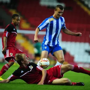Print of a young footballer in action at Ashton Gate Print of a young footballer in action at Ashton Gate