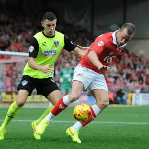 Intense Rivalry: Wilbraham vs. Wilson Clash at Ashton Gate - Football Showdown between Bristol City's Wilbraham and Oldham Athletic's Wilson