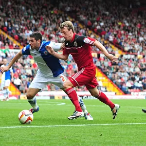 Intense Rivalry: Woolford vs. Orr - A Football Battle in the Championship Clash between Bristol City and Blackburn Rovers