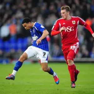 Ipswich Town's Carlos Edwards Outmuscles Bristol City's Chris Wood in March 2012 Clash at Portman Road