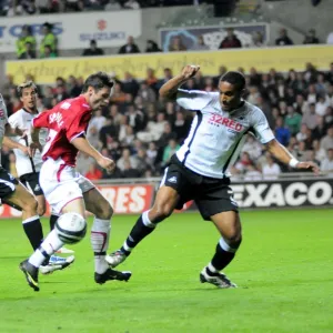 Ivan Sproule gets tackled by Ashley Williams