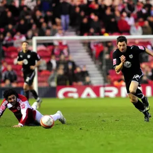 Ivan Sproule goes past Julio Arca