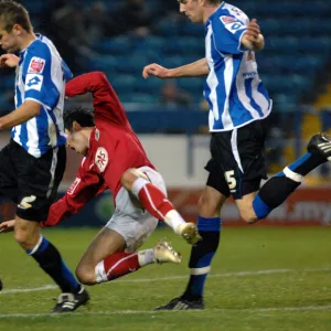 Ivan Sproule is muscled off the ball