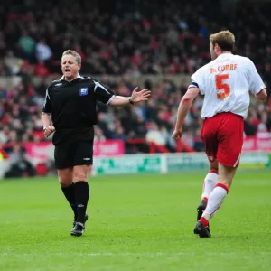 Jamie McCombe and referee Chris Webster exchange