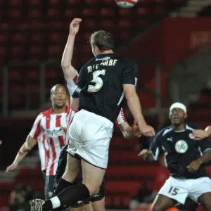 Jamie McCombes header hits the hand of defender Alex Pearce Print Jamie McCombes header hits the hand of defender Alex Pearce Print