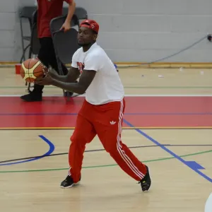 Print of Jay Emmanuel-Thomas playing basketball after a match