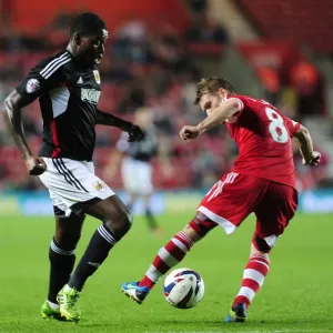 Jay Emmanuel-Thomas of Bristol City Passes Past Steven Davis of Southampton during Capital One Cup Match