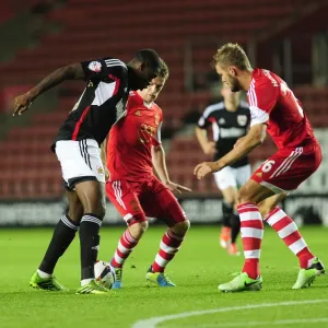 Jay Emmanuel-Thomas Tries to Beat Southampton's Defense - Football Rivalry at St Mary's Stadium, 2013