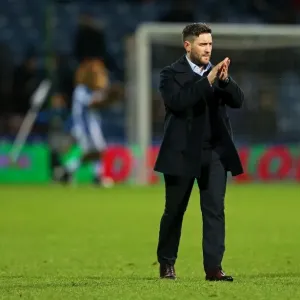 Print of Lee Johnson applauding fans at Huddersfield Town v Bristol City Print of Lee Johnson applauding fans at Huddersfield Town v Bristol City