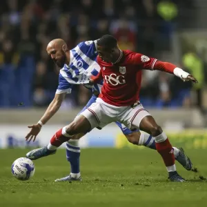 Print of Jonathan Kodjia blocking Bruno Saltor in a Championship match