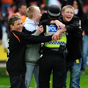 Jubilant Blackpool Fans Celebrate Championship Victory with Police: Blackpool v Bristol City (02/05/2010)
