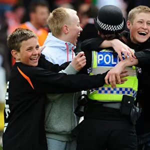 Jubilant Blackpool Fans Celebrate with Police after Championship Victory over Bristol City (02/05/2010)