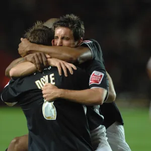 Lee Johnson celebrates with team mates david noble and marvin elliott