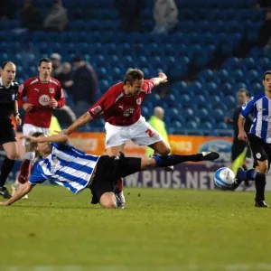 Lee Trundle battles for the ball
