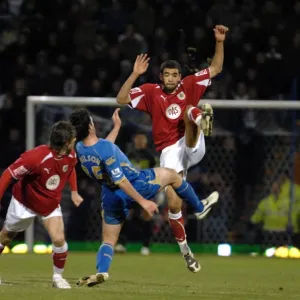 Liam Fontaine clears the ball ahead of Marc