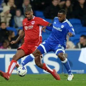 Print of Mark Little vs. Junior Hoilett at Cardiff City Stadium Print of Mark Little vs. Junior Hoilett at Cardiff City Stadium