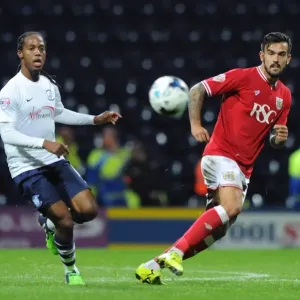 Marlon Pack of Bristol City Playing a Pass Amidst Preston North End's Daniel Johnson - Sky Bet Championship Clash Marlon Pack of Bristol City Playing a Pass Amidst Preston North End's Daniel Johnson - Sky Bet Championship Clash