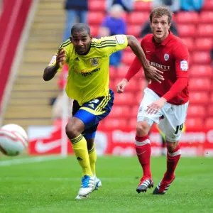 Marvin Elliott Chases Ball in Championship Match: Barnsley vs. Bristol City (2011)