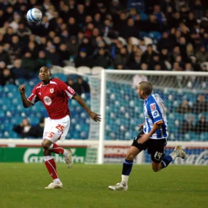 Marvin Elliott chases for the ball along with Jimmy Smith