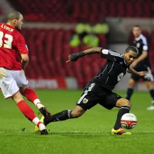Marvin Elliott Tackles Joel Lynch: Intense Moment in Nottingham Forest vs. Bristol City Football Match, Npower Championship, 2011