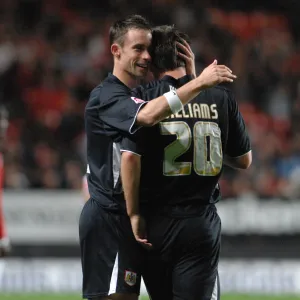 Michael McIndoe congratulates goalscorer Gavin Williams