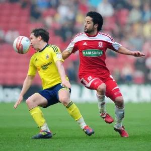 Neil Kilkenny vs. Merouane Zemmama: Battle for the Ball in Middlesbrough vs. Bristol City Football Match, March 2012 Neil Kilkenny vs. Merouane Zemmama: Battle for the Ball in Middlesbrough vs. Bristol City Football Match, March 2012