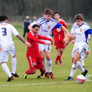 Nicky Maynard's Determined Battle for Possession Against Swindon Defense Nicky Maynard's Determined Battle for Possession Against Swindon Defense