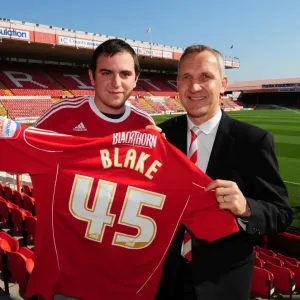 NPower super fan Dan Blake is presented with a shirt bt Bristol City Manager, Keith Milen NPower super fan Dan Blake is presented with a shirt bt Bristol City Manager, Keith Milen
