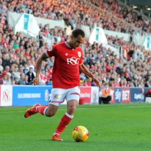 Packed Dolman Stand: Elliott Bennett of Bristol City Faces Off Against Fulham in Championship Clash at Ashton Gate