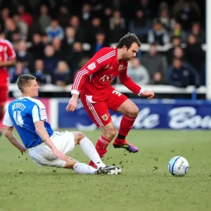 Peterborough's Ryan Bennett Stops Brett Pitman's Advance: Peterborough United vs. Bristol City Football Rivalry
