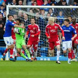 Portsmouth's Jason Pearce Fouls Bristol City's David James during Match