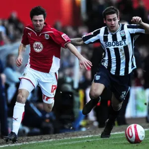 Race for the Ball: Ivan Sproule vs. Joe Mattock in Bristol City vs. West Bromwich Albion Football Championship Clash