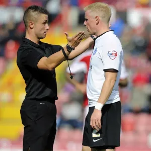 Referee James Adcock Confers with Craig Alcock of Peterborough United during Bristol City vs Peterborough United, Sky Bet League One (Football Match)