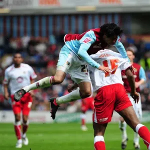 Rhys Williams climbs over Dele Adebola
