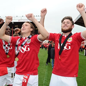 Triumphant Moment: Agard, Freeman, and Burns Celebrate Bristol City's Victory over Walsall
